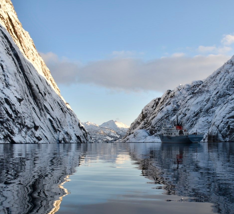 Sailing through the snowy Trollfjord